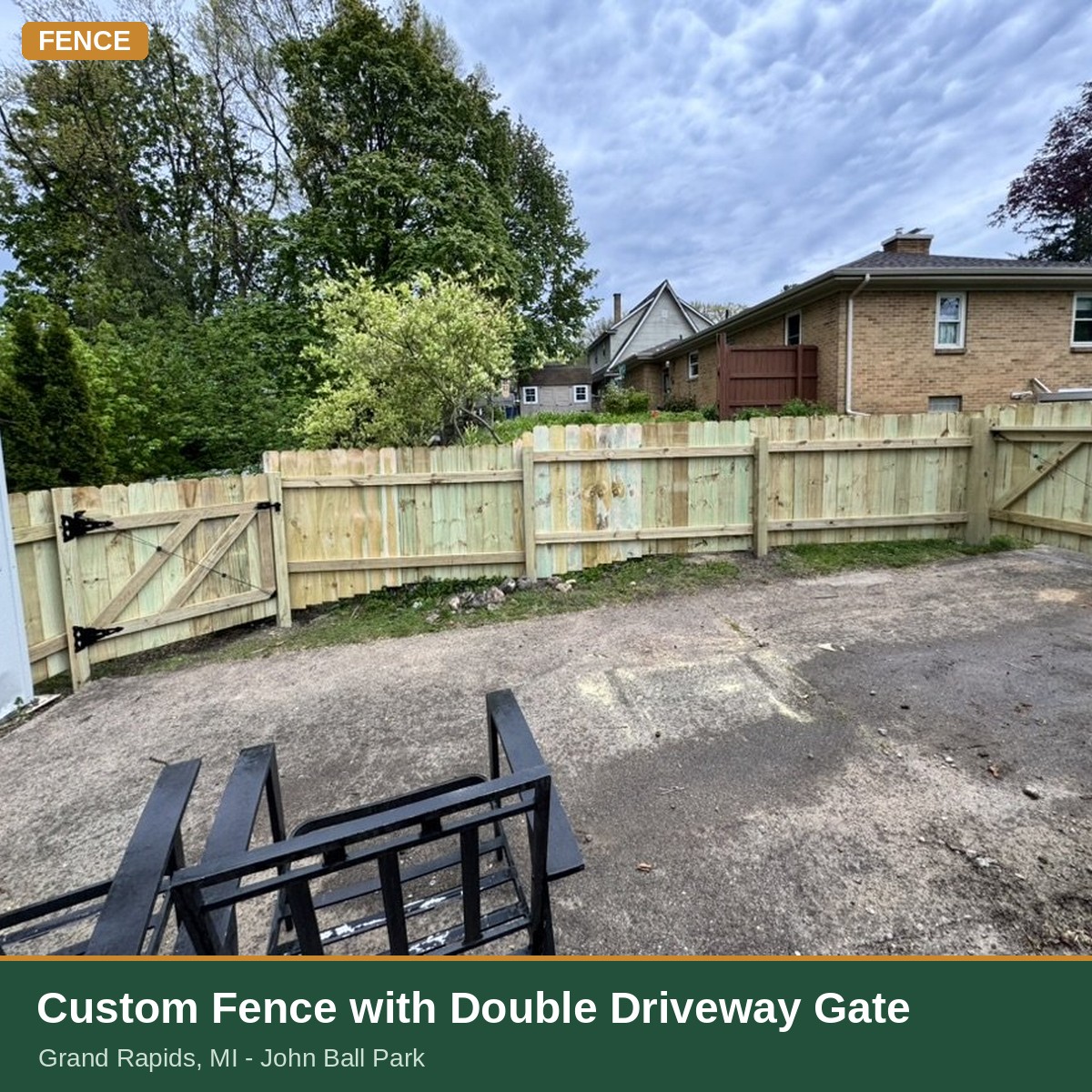 Custom wood fence with double driveway gate built in Grand Rapids, MI (John Ball Park)