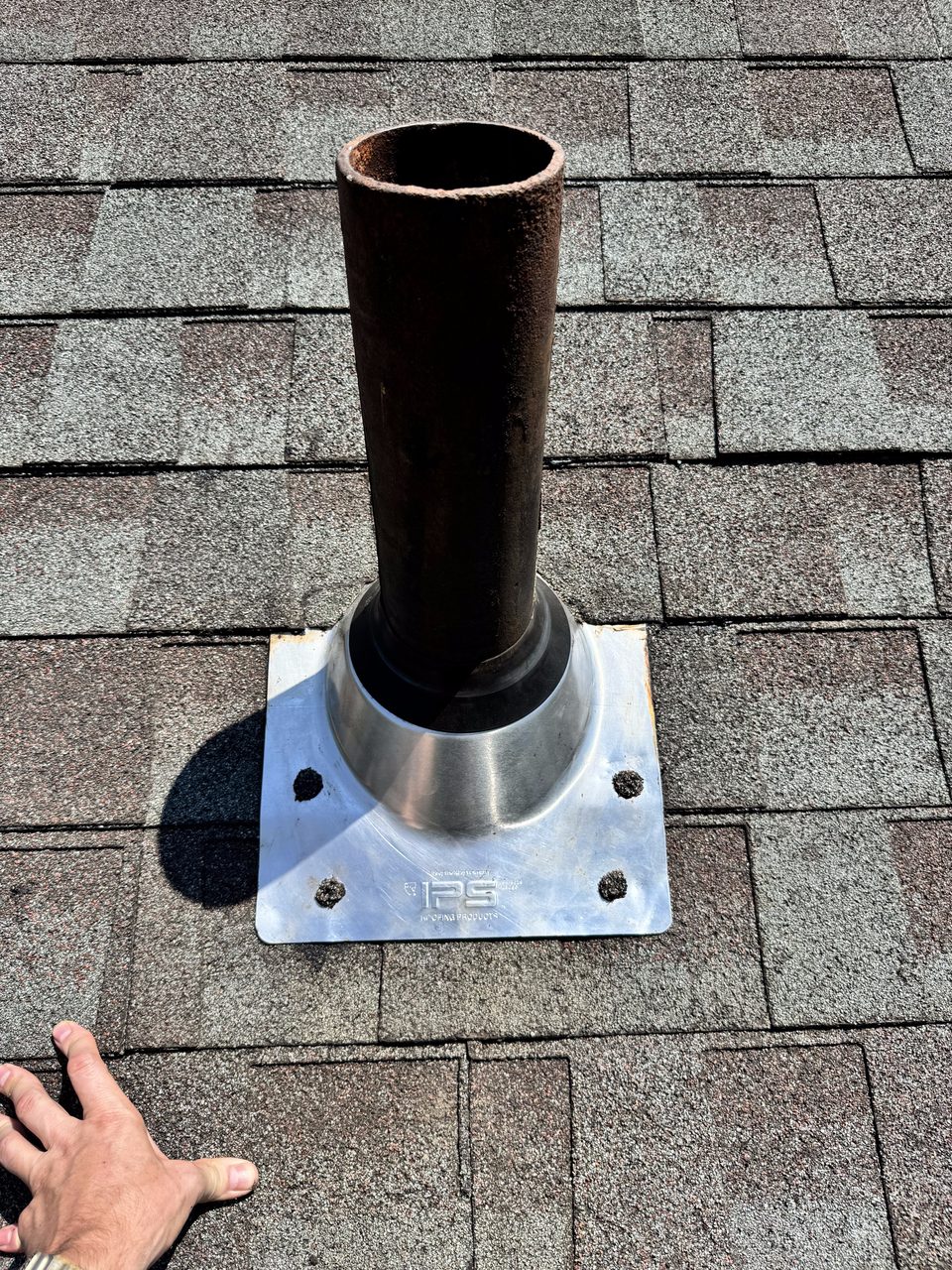 New roof vent pipe flashing installed during an exterior repair, West Michigan